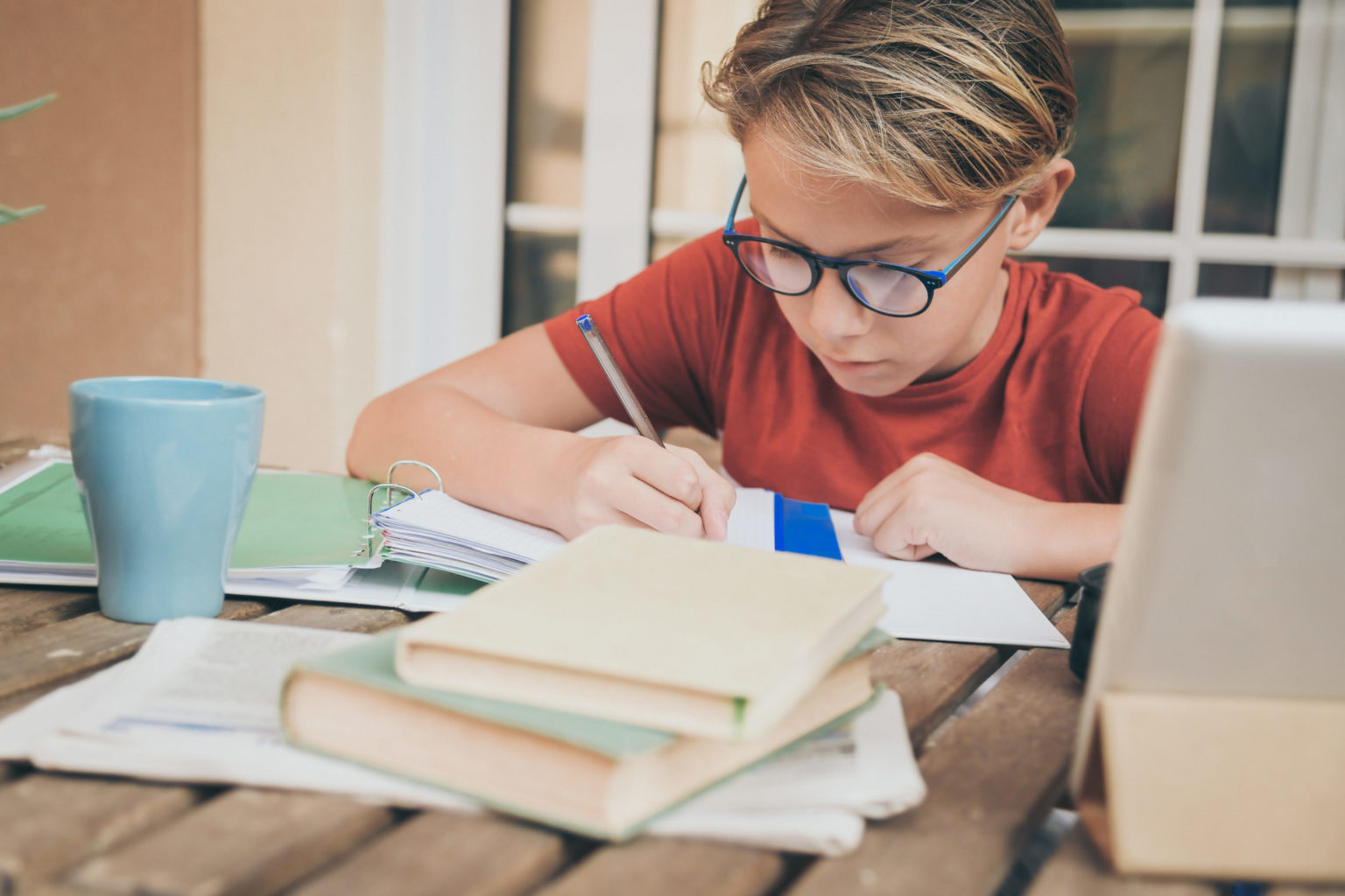 Young Student Doing Homework At Home Sitting At Table Outdoor. B