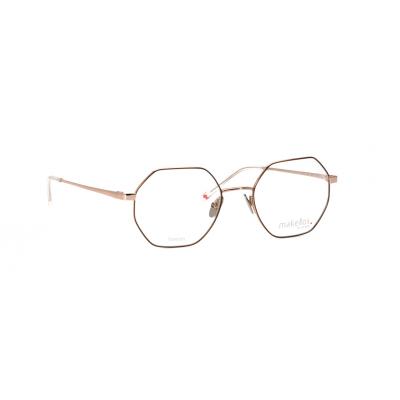 Hexagonale Damenbrille "Makellos ME 1039" mit dünnem, goldenem Rahmen.
