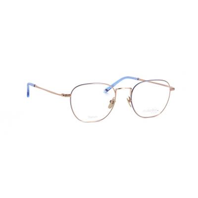 Unisexbrille Makellos ME 1085 mit goldenem Gestell und blauen Bügelenden.