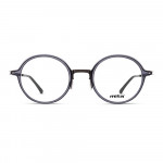 Unisex Brille MITA MT1018, runde Form, schwarzer Rahmen mit transparenten Gläsern. Ideal für stilvolles Design und Komfort.