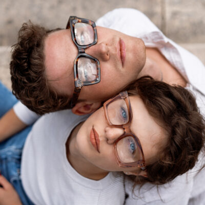 Two Attractive Students Man And Woman Wearing Stylish Glasses Sitting Floor